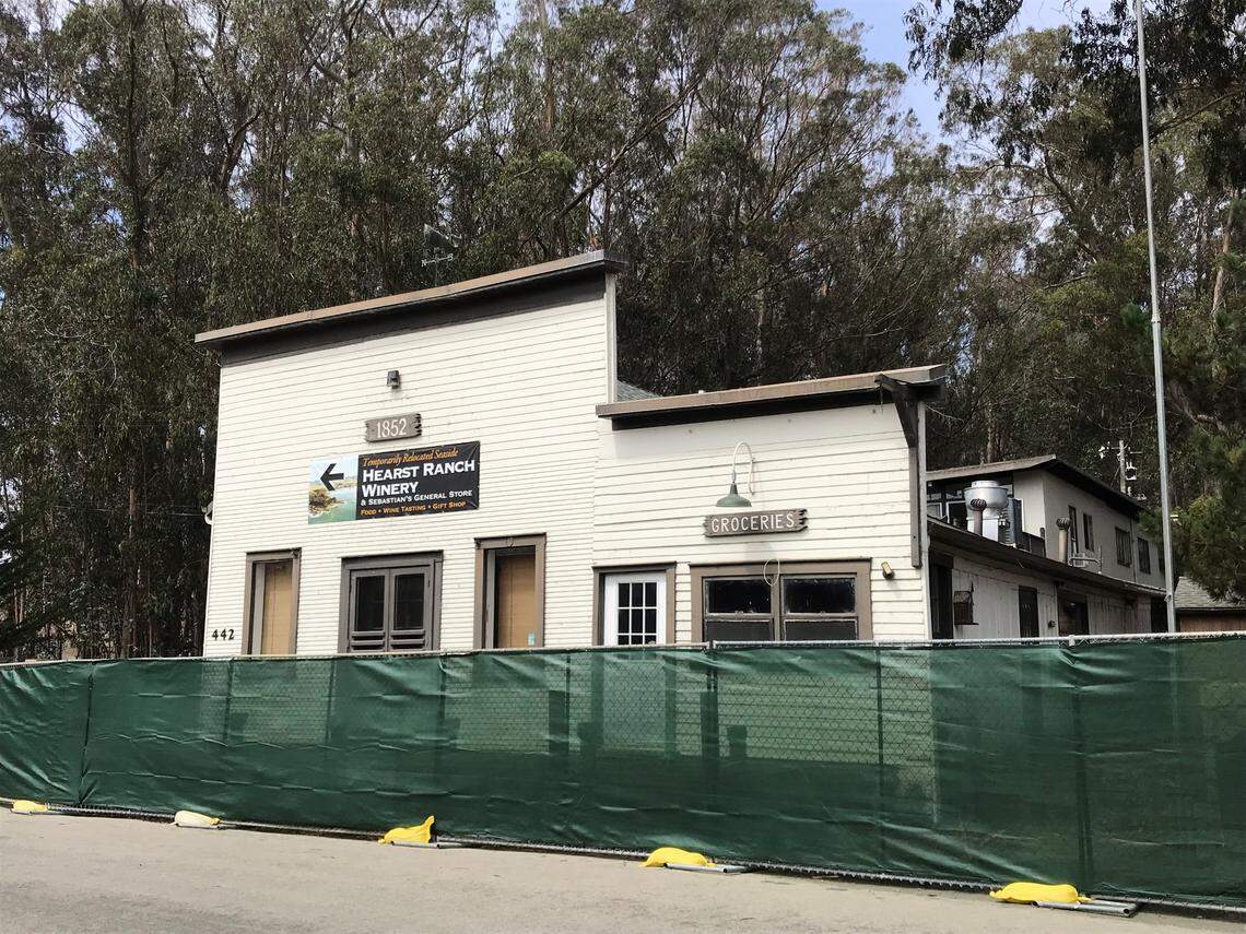 Heavy green construction fencing surrounds California State Historical Monument No. 726, Sebastian’s General Store in Old San Simeon Village. Restoration work began there on Sept. 20, 2021.