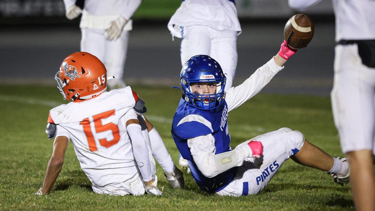 James Nickel holds the ball after making a touchdown catch, with Jacob Perry at left. Morro Bay beat Atascadero 42-14 in a high school football playoff game on Nov. 15, 2024.