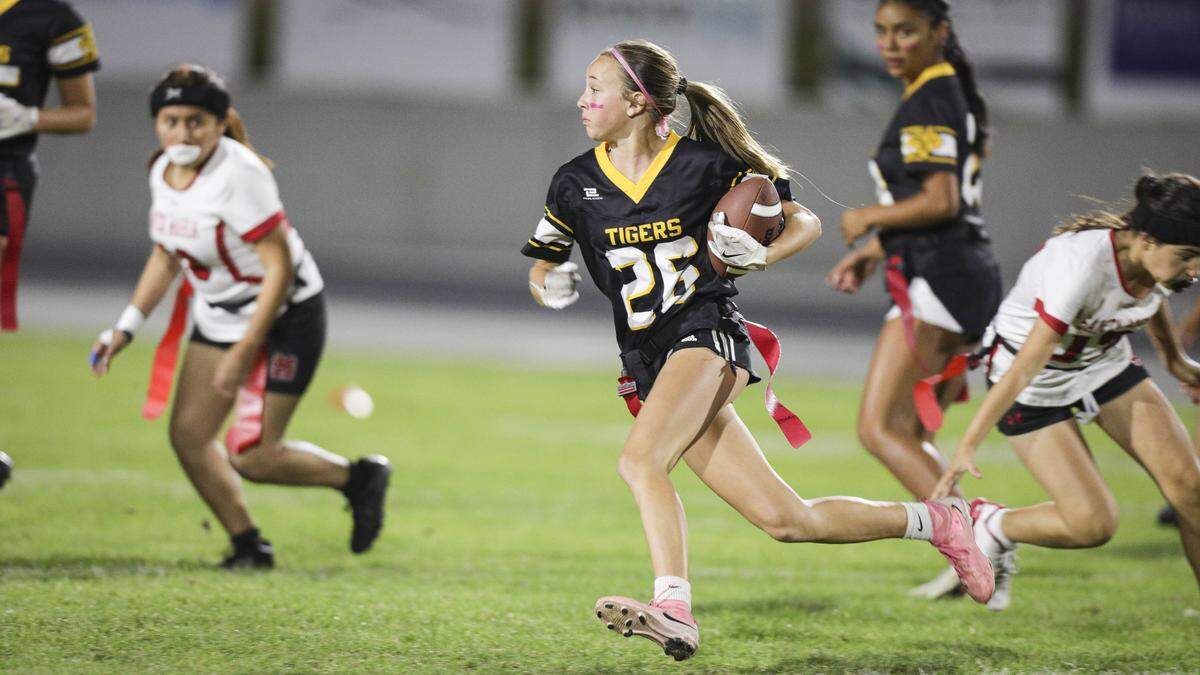 Emily Peters runs for the game's first touchdown. San Luis Obispo beat Santa Maria 51-6 in a girl's flag football game seen here on Oct. 16, 2025.