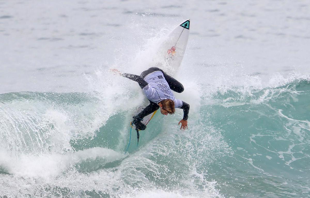 A surfer competes at the SLO CAL Open Qualifying Series at Morro Rock on Saturday, Feb. 26, 2022.