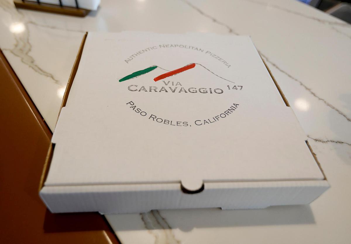 They hand-make their own pizza boxes. Drs. Kathryn and Pat Haran opened a new Neopolitan pizza establishment named Via Carvaggio 147 in Paso Market Walk in Paso Robles, CA.