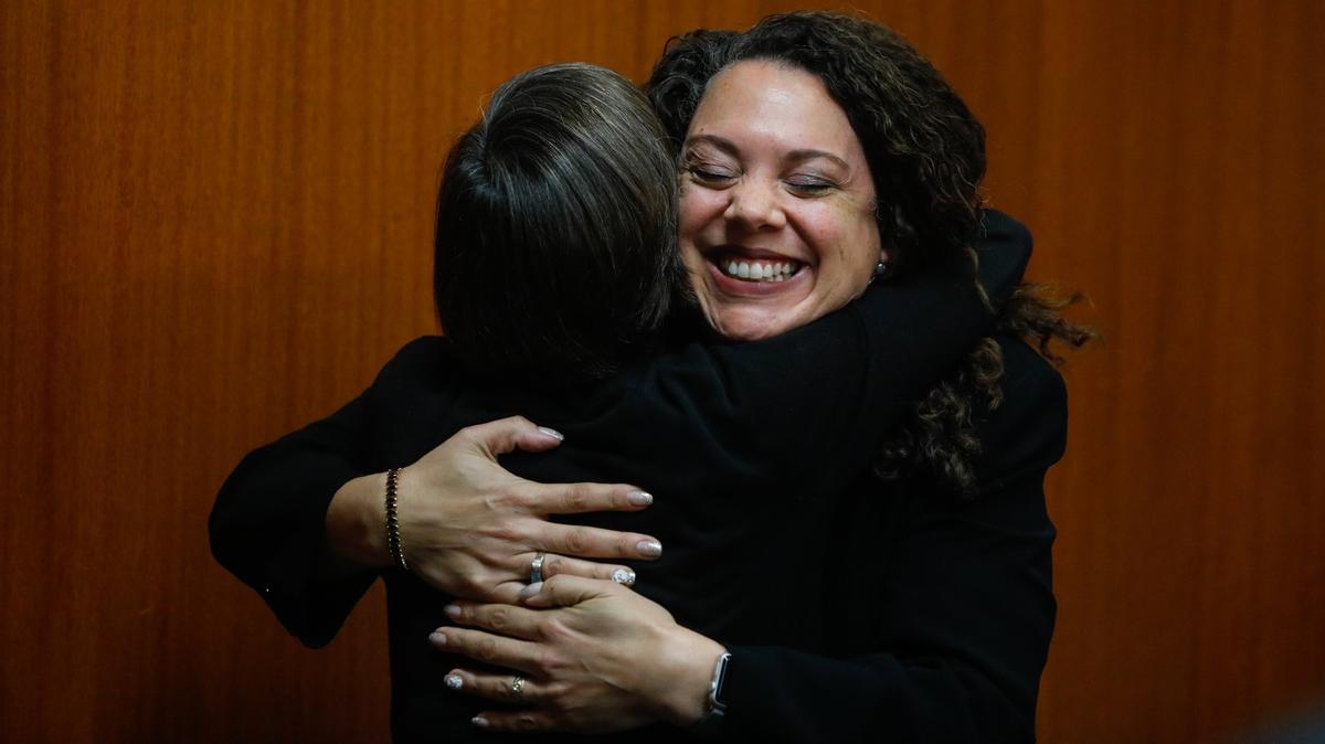 Newly elected San Luis Obispo Councilwoman Erica Stewart gets a hug from fellow Councilwoman Andy Pease in 2018.