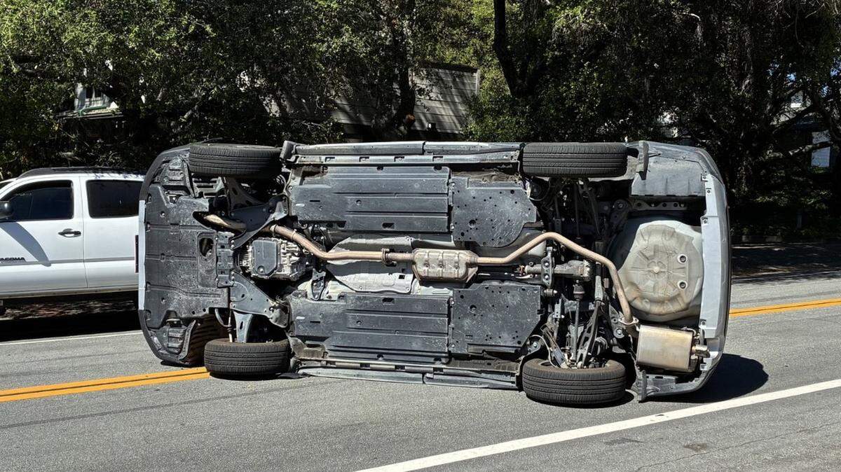 A car flipped on its side after ramming into a parked car at Chorro Street and West Street in San Luis Obispo on March 20, 2026.