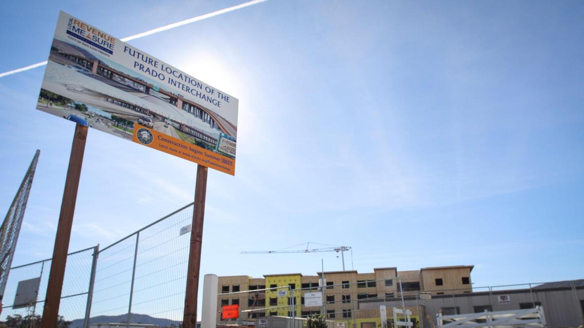 The Prado Road interchange project will bring another crossing over Highway 101. A sign touts the future overpass on Dec. 15, 2023.