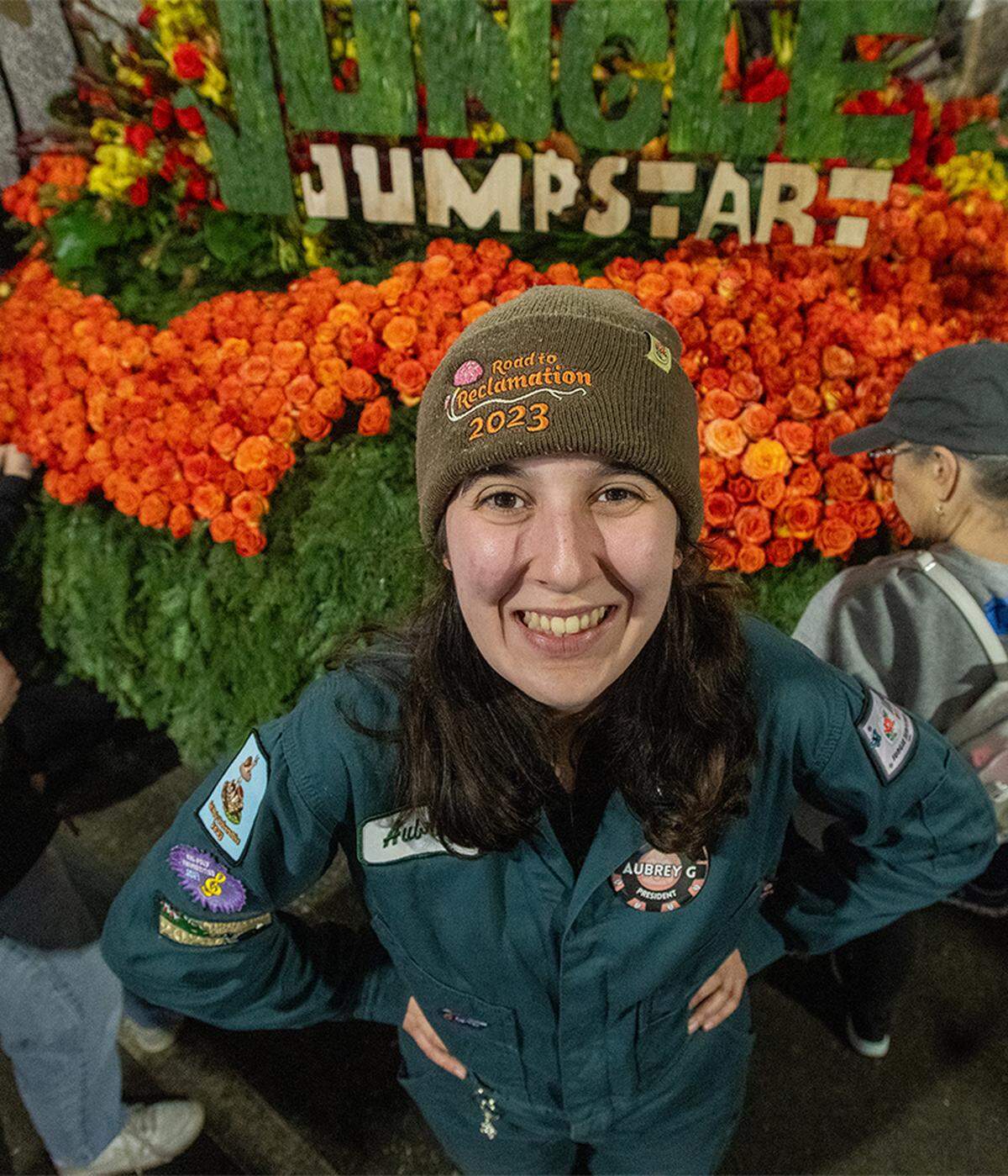 The Cal Poly Universities Rose Float, Jungle Jumpstart, makes its way toward Colorado Boulevard in Pasadena during the Rose Parade on Jan. 1, 2026. Cal Poly Rose float president Aubrey Goings pictured with the float.