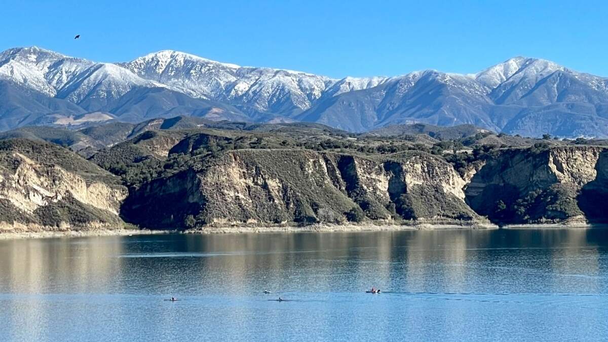 The snow-covered San Rafael Mountains loom over Lake Cachuma following last week’s storm. Despite significant rainfall in many areas, the storm did little to boost local water supplies.