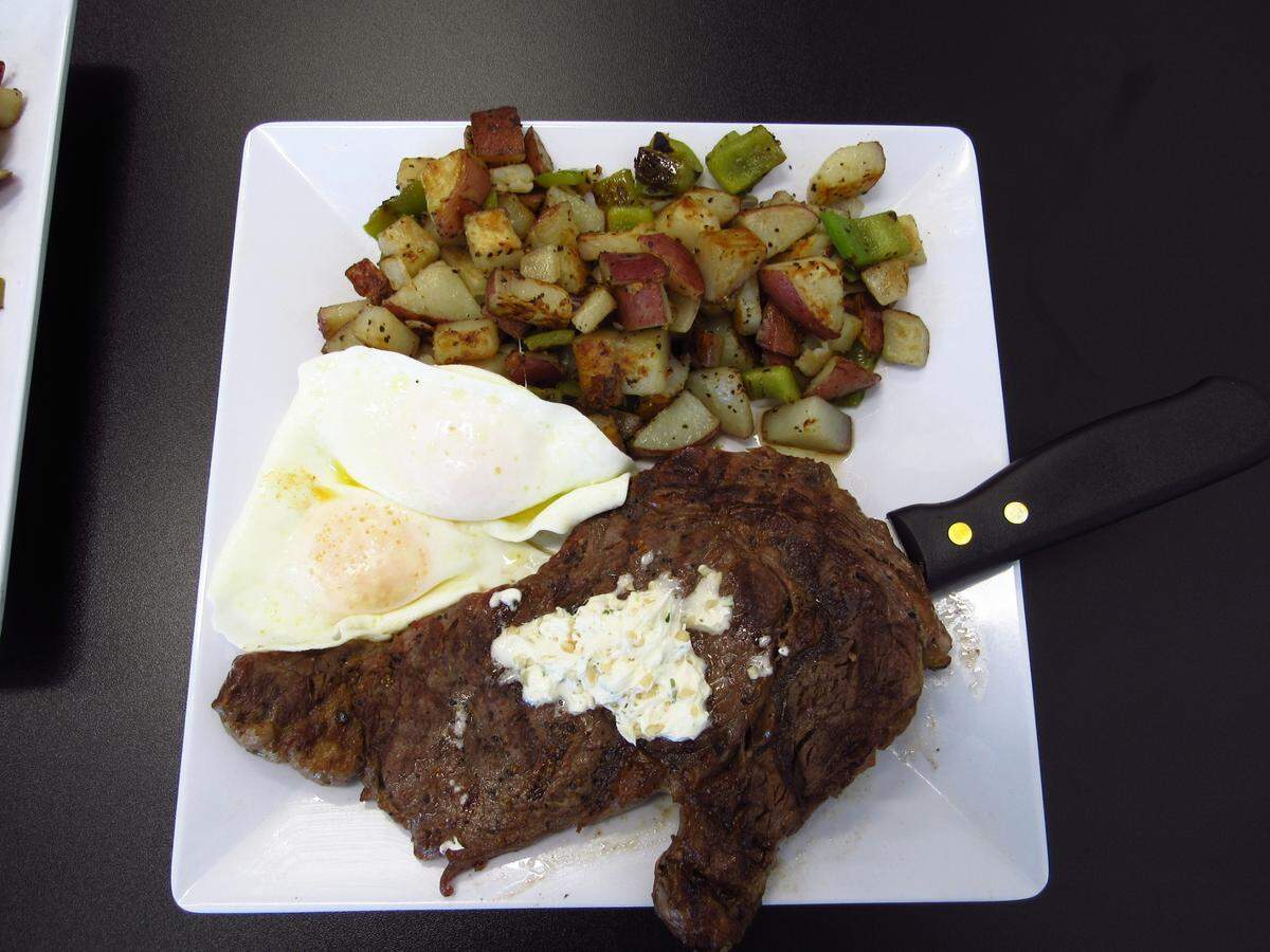 Menu items like ribeye steak and eggs are featured at Honey I’m Home Pismo Cafe.