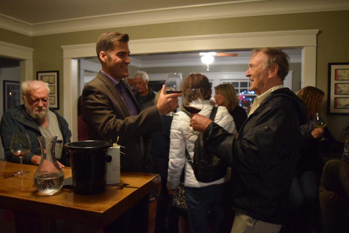 Jimmy Paulding, center, exchanges a toast with a supporter Tuesday night at the Timbre Winery tasting room in the Village of Arroyo Grande. Paulding is running for a seat on the Arroyo Grande City Council, along with Keith Storton, Coleen Kubel, John Mack and Terry Fowler-Payne.