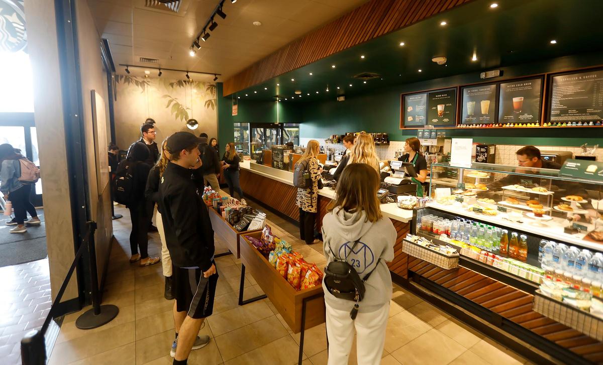 Cal Poly students are traveling home for break despite the coronavirus spreading. A long line of students wait in line at the Starbuck’s inside the University Union.