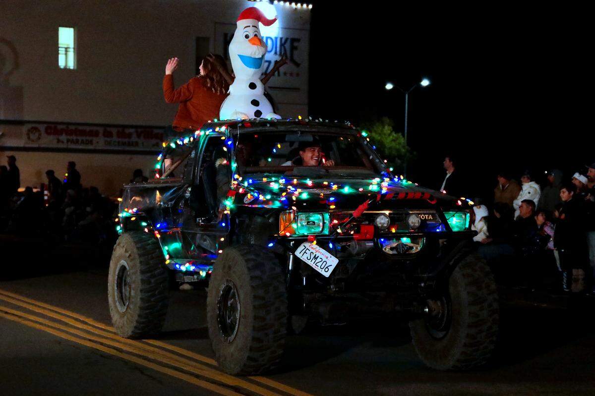 The parade featured nods to well-known holiday characters like the Grinch from Dr. Suess’ ”How the Grinch Stole Christmas” and Olaf (above) from Disney’s Frozen.