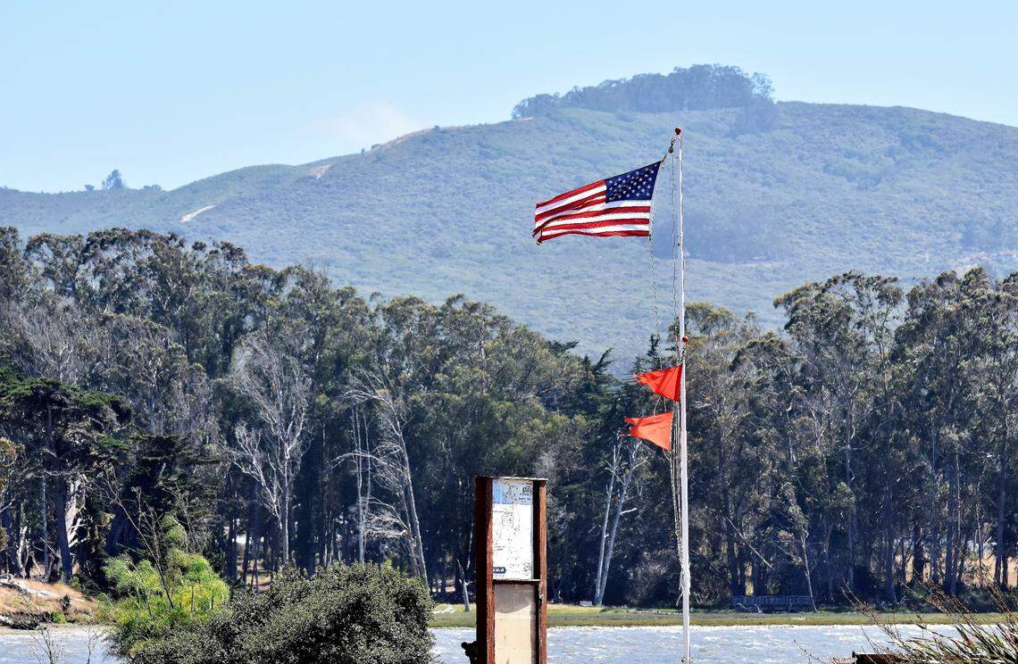 An American flag is buffeted by northwesterly (onshore) winds at Baywood Park in Los Osos.