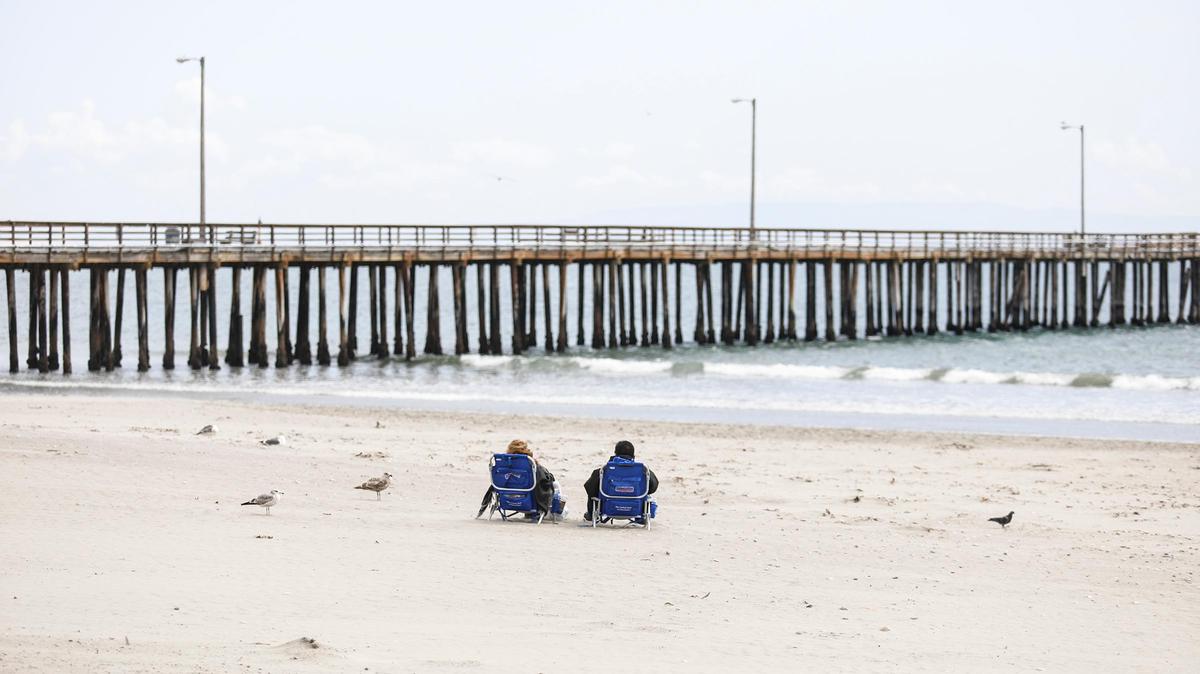 Beachgoers lounge at Avila Beach in April 2020.