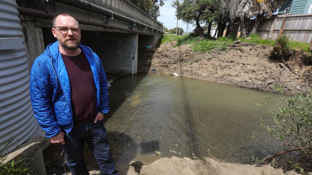 Greg Kwolek, Morro Bay’s Public Works director, stands besides Morro Creek at Main Street in Morro Bay on April 11, 2023. It was one of the problem areas in recent flood events.