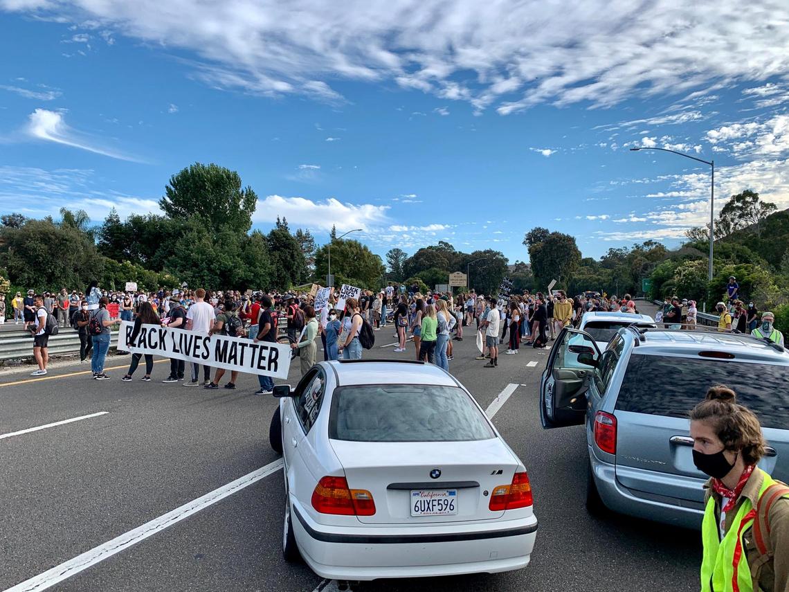 No Justice No Peace protesters blocks traffic on Highway 101 during Tuesday’s march in San Luis Obispo.