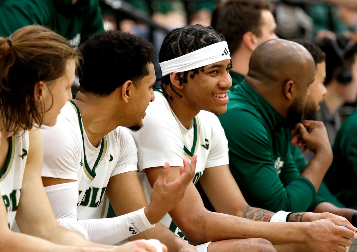 Cayden Ward, right, Jarred Hyder and Owen Koonce, left, share a laugh during a Cal Poly basketball game against Cal State Bakersfield, Saturday, March 1, 2025 at Mott Athletics Center.