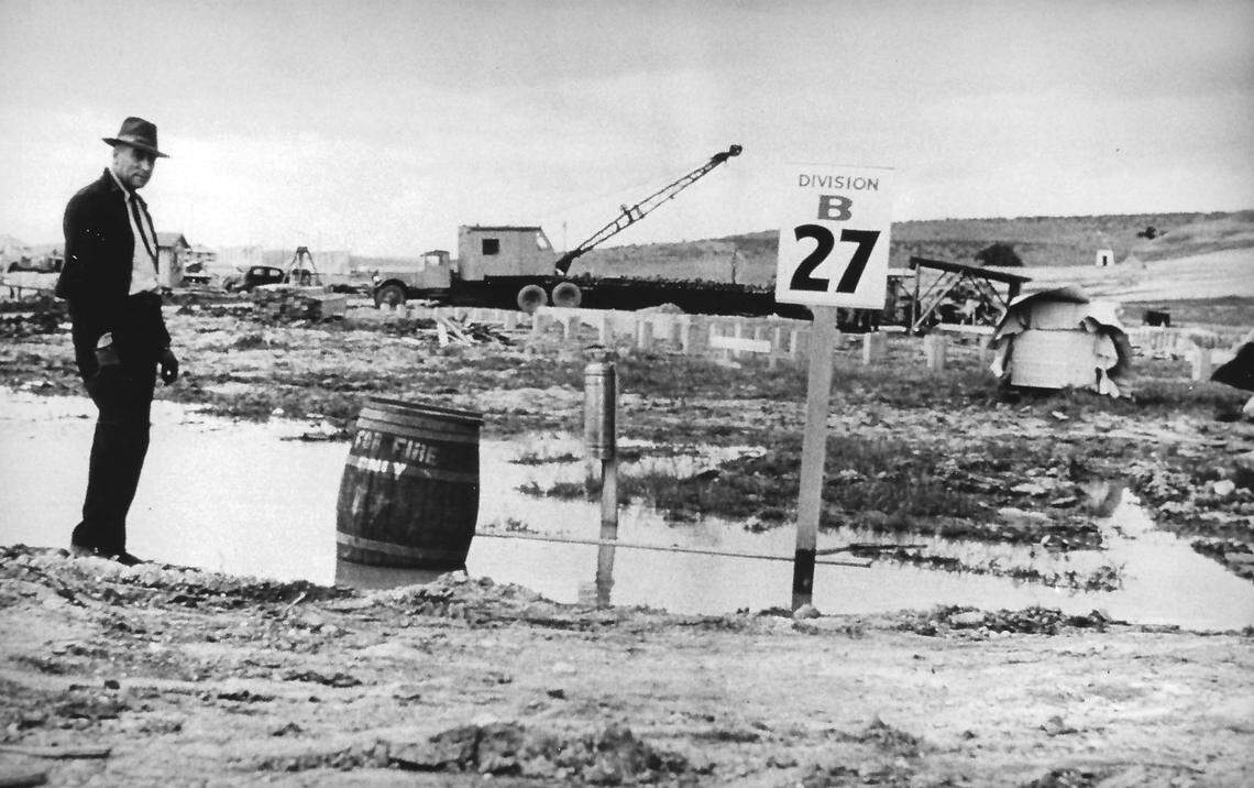 Al Johnson, heavy equipment superintendent, kept work moving ahead in 1941 at Camp Roberts during record rains. At times workers were knee deep in mud.