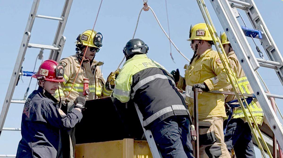 Cal Fire firefighters work to rescue a man caught in an industrial mulcher in Nipomo on Aug. 29, 2025.