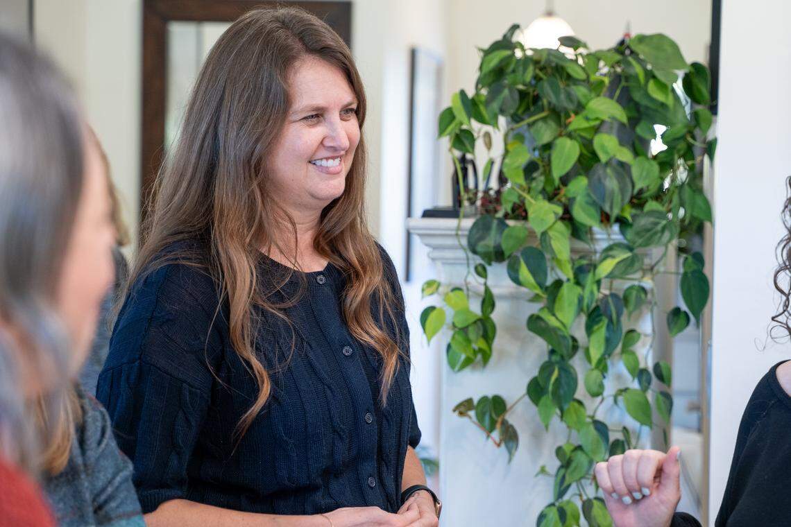 Womenade SLO execuitve director Elaine Stewart speaks with volunteers at her home in San Luis Obispo on Saturday, Dec. 6, 2025. Womenade SLO was founded in April 2025 as a successor to the Womenade organization that served San Luis Obispo County from 2003 to 2019.