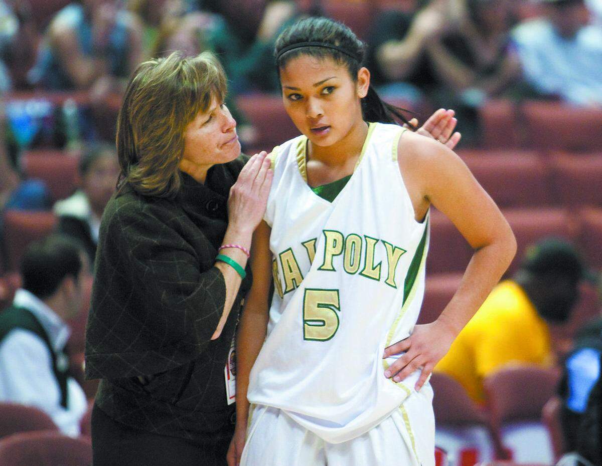 Cal Poly head coach Faith Mimnaugh, left, with former Mustang Ariana Elegado (5) in 2014.