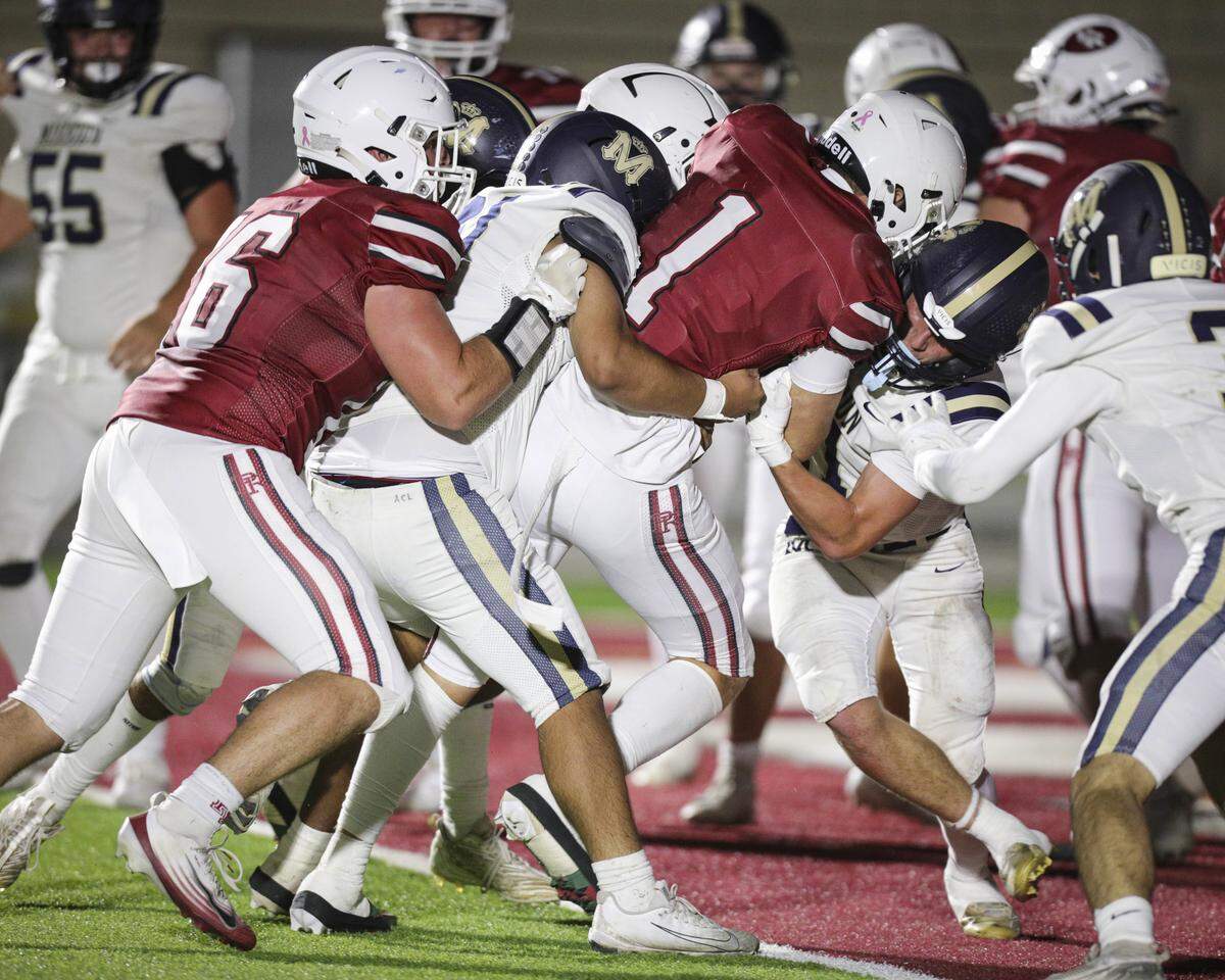 Blayne Lowry, 1,  takes the ball into the end zone. Paso Robles beat Mission Prep 27-13 on Oct. 22, 2025.