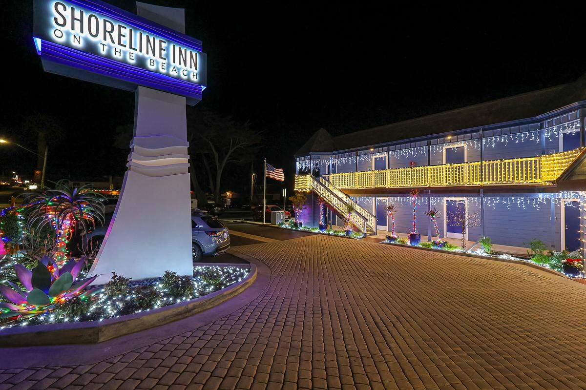 Holiday lights illuminate Shoreline Inn at the Beach in Cayucos in 2023. The San Luis Obispo County hotel is decorated with more than 25,000 lights along with a snowman display and reindeer grazing on the lawn