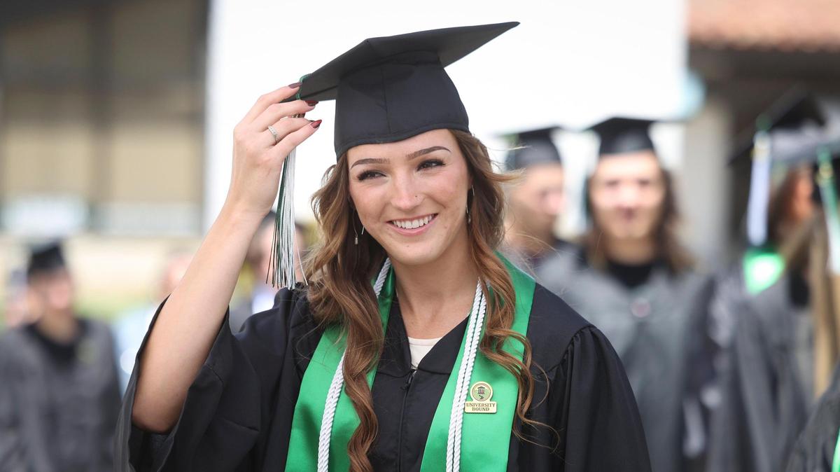 Elyse Smith smiles as her name is announced graduation as a business administration major. Cuesta College celebrated its 60th Commencement Ceremony on campus May 23, 2025.