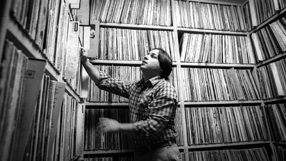 KCBX-FM’s Rod Flores hunts for a record for his “Morning Cup of Jazz show at 8:30 a.m. in the 20,000-record library. All have been donated to the station. This image is from Oct. 10, 1980.