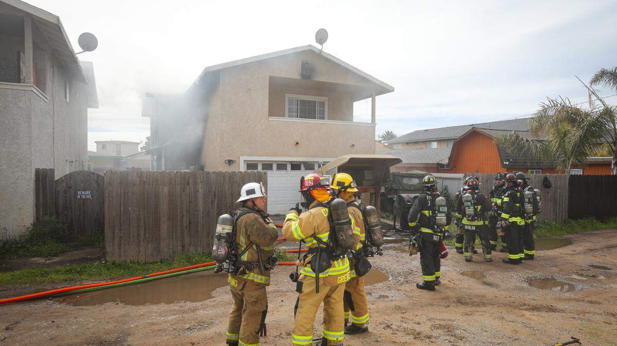 Firefighters battle a two-alarm blaze that damaged two floors of a home on the 1500 block of 22nd Street in Oceano on Monday, Feb 27, 2023. Five Cities Authority, Cal Fire and the Santa Maria Fire Department were among the agencies that responded to the scene.