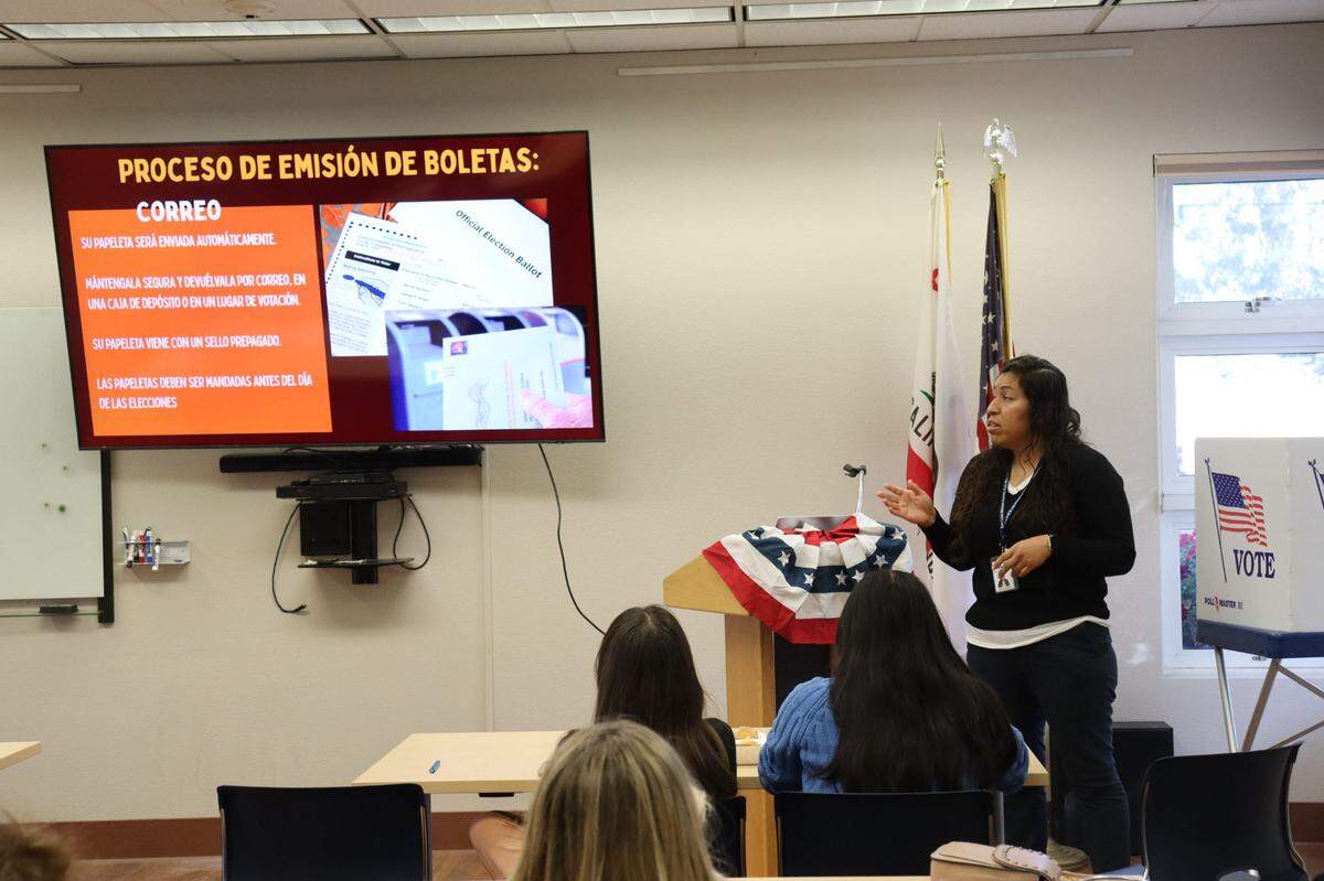 Barbara Hurtado, one of the Clerk-Recorder’s Office’s four bilingual staff members, presents information in Spanish on how to register and vote in Nipomo, on Sept. 11, 2024. The county was calling for bilingual people to work the polls on Election Day, providing in-person guidance for Spanish-speaking voters. The job is a paid position.