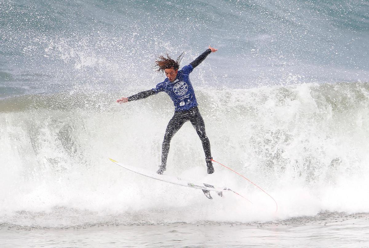 A surfer competes at the SLO CAL Open Qualifying Series at Morro Rock on Saturday, Feb. 26, 2022.