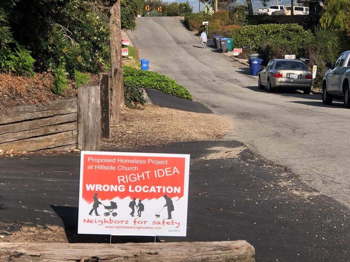 Neighbors who oppose expanding a homeless services center in Grover Beach have put up yard signs with their slogan: “Right idea, wrong location.”