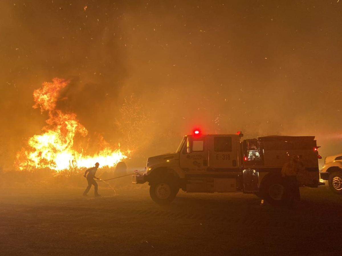 Santa Barbara County firefighterss battle flames along CA Hwy-154 near San Antonio Creek Rd Monday night.