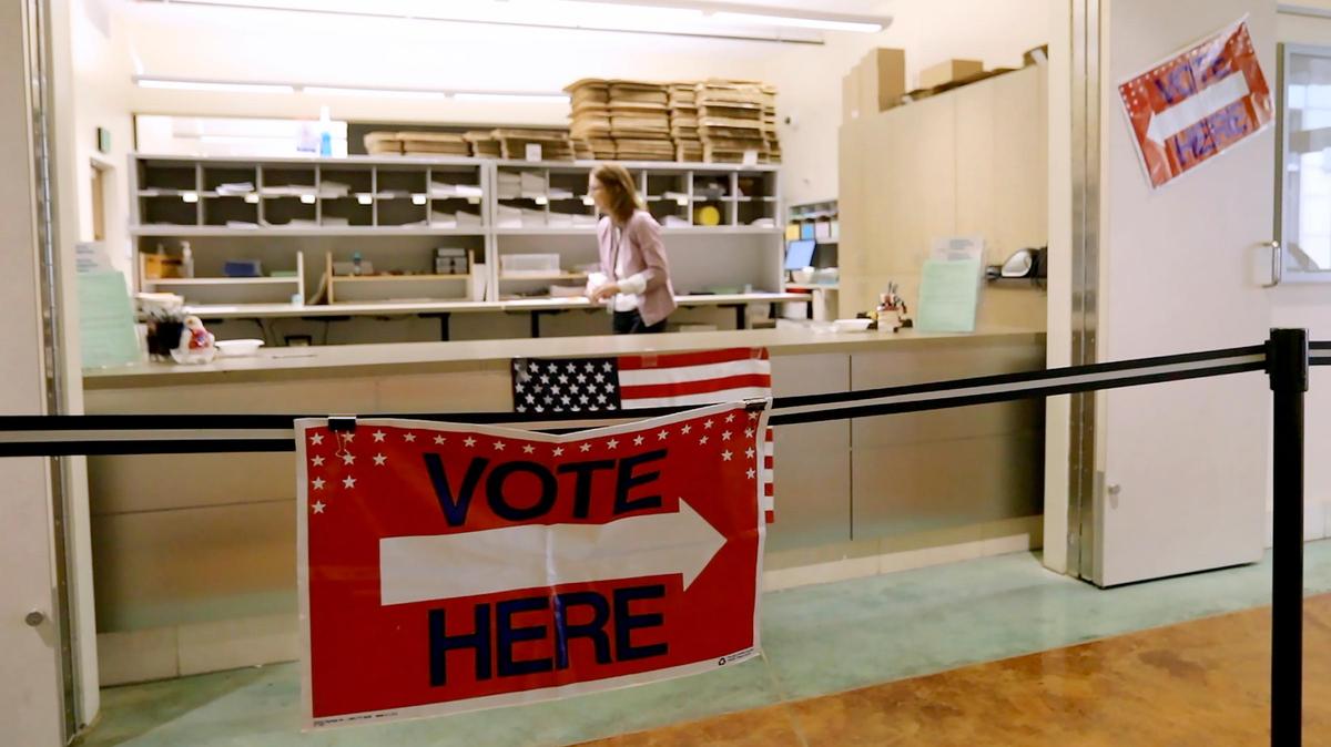 A sign points to the elections counter inside the San Luis Obispo County Government Center in San Luis Obispo in March 2020.
