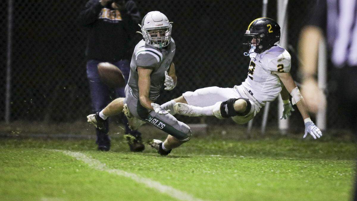 Cameron Stevens defends as Andrew De La Motte falls at right. The Eagles were penalized on this play. Templeton beat San Luis Obispo High School 48-7 in a football game on Oct. 17, 2025.
