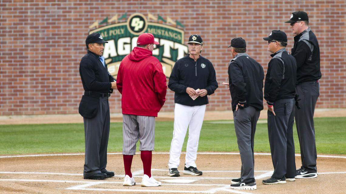 Mustang. head coach Larry Lee has the linup and ground rules meeting before the game. This is his 24th year as head coach at the university. Nathan Choate represented the Cougars. Washington State beat Cal Poly 5-4 on Feb. 23, 2026.