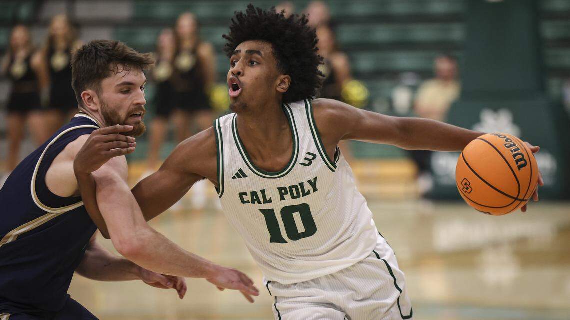 Hamad Mousa tries to drive around Patrick McMahon. Montana State beat Cal Poly 83-80 in a men’s basketball game on Dec. 16, 2025.