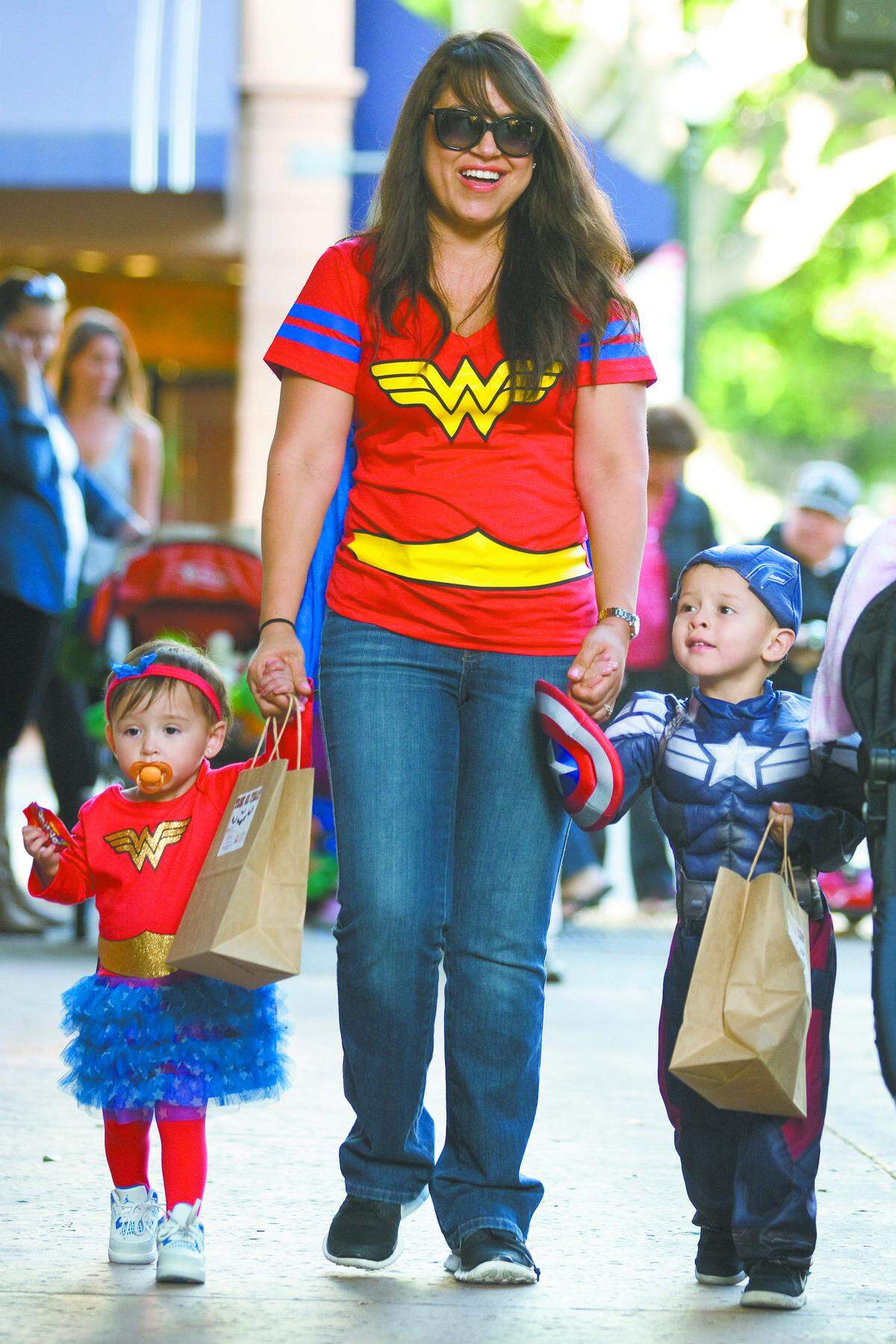 Families gathered for a special trick-or-treat at the Thursday night Farmers Market on Higuera Street in downtown San Luis Obispo. From left, Sophia, age 1, Angie and 2-year-old Josh Enriquez dressed up as their favorite superheroes.