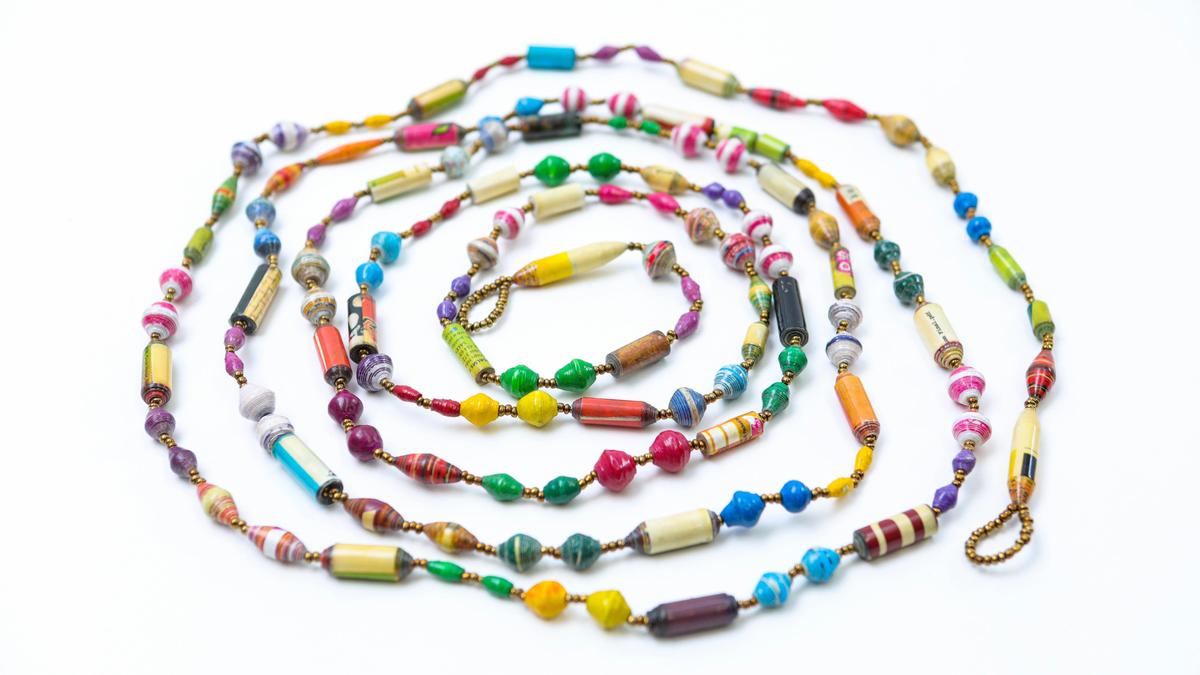 Garlands made of African beads benefit children in Uganda