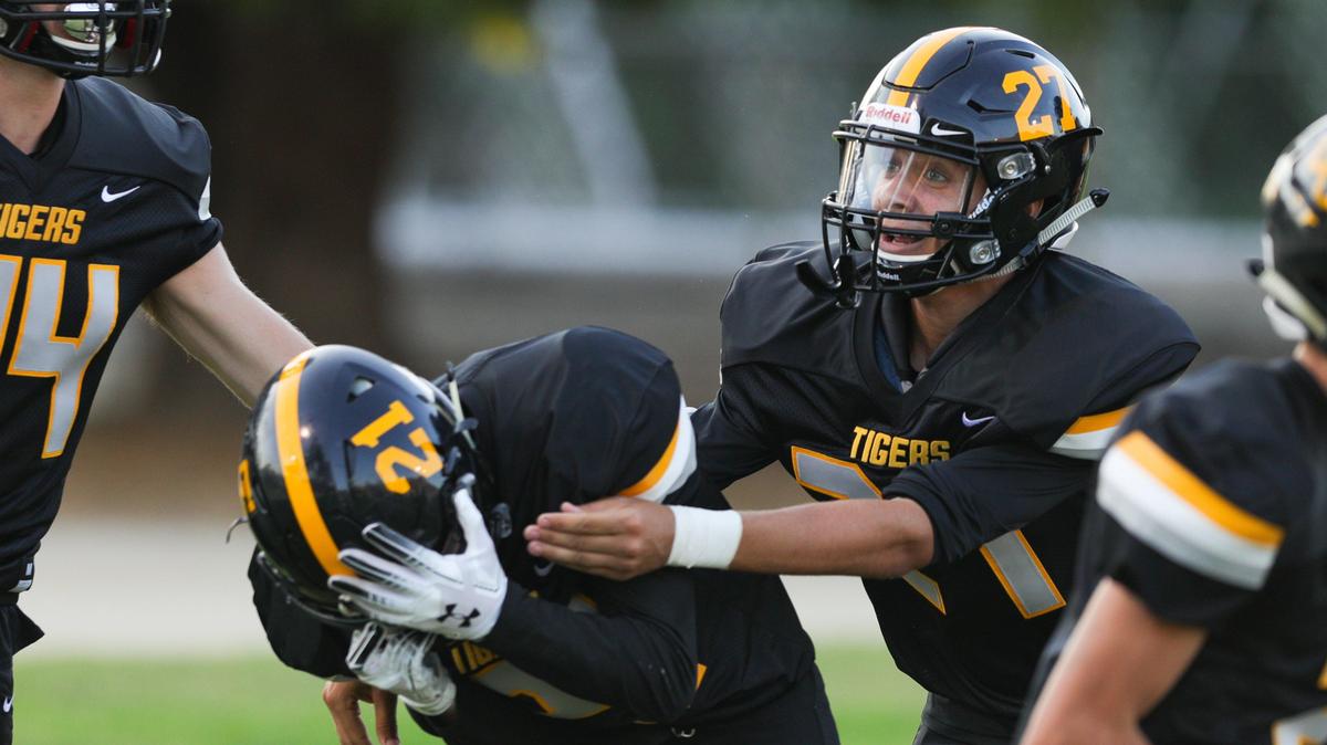 San Luis Obispo celebrates an interception that lead to an early 14-0 lead over Arroyo Grande. 8-23-2019 David Middlecamp