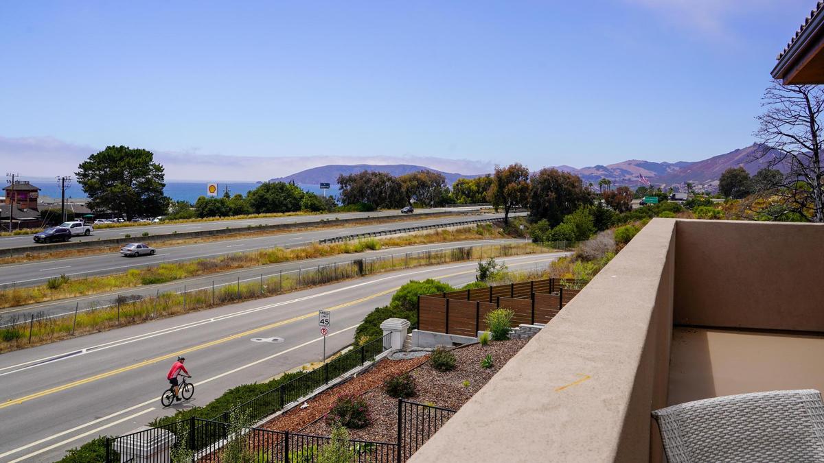 The balcony of one of the homes at Barcelona Point, a new luxury home development in Pismo Beach, looks out over Highway 101, pictured here Tuesday, July 1, 2025. The development is nestled into the base of the mountains that border Pismo Beach to the east and bordered by Mattie Road and Highway 101 to the west.