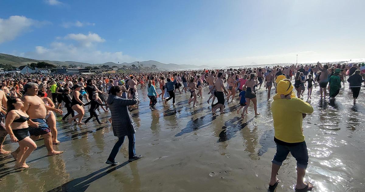 Approximately a thousand people took to the ocean waves. The 43rd Carlin Soule Memorial Polar Bear Dip invites community members to don swimsuits and silly costumes before welcoming the new year by running into the waves.