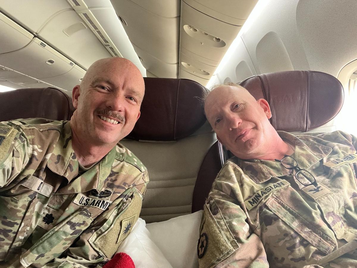 San Luis Obispo County District Attorney Dan Dow, left, returns home on a plane with Colonel Larry Minasain from a deployment with the California National Guard in the MIddle East on March 28, 2024.