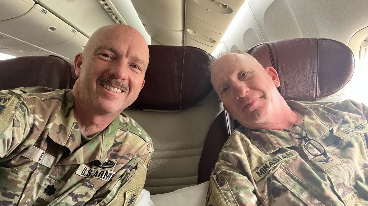 San Luis Obispo County District Attorney Dan Dow, left, returns home on a plane with Colonel Larry Minasain from a deployment with the California National Guard in the MIddle East on March 28, 2024.