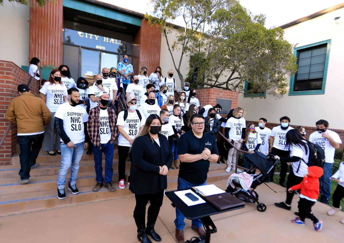 A group of about 50 employees of a San Luis Obispo County cannabis company, Natural Healing Center, lobbied for the San Luis Obispo City Council to reverse its decision to revoke its retail shop operator permit in October, but the council rejected their efforts. Valnette Garcia, left, and Joe Armendariz speak at the podium in front of SLO City Hall.