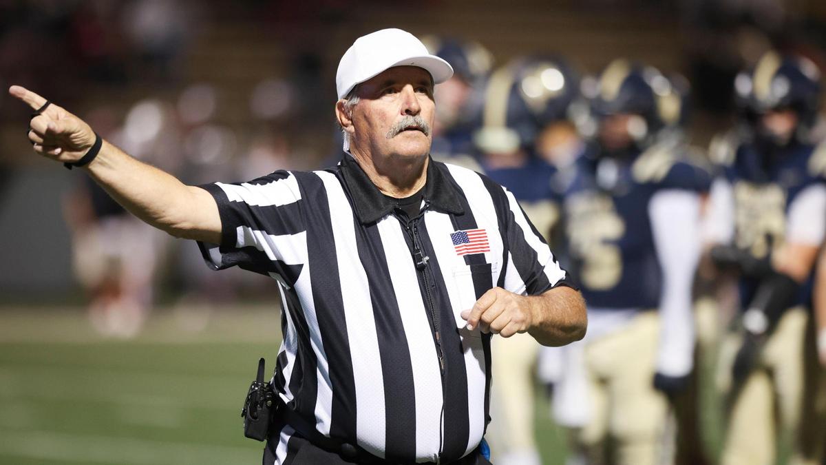 Referee Garold Shaffer signals first down while working a game between Mission Prep and Paso Robles on Oct. 25, 2024. The game was held at Cal Poly’s Mustang Memorial Field.