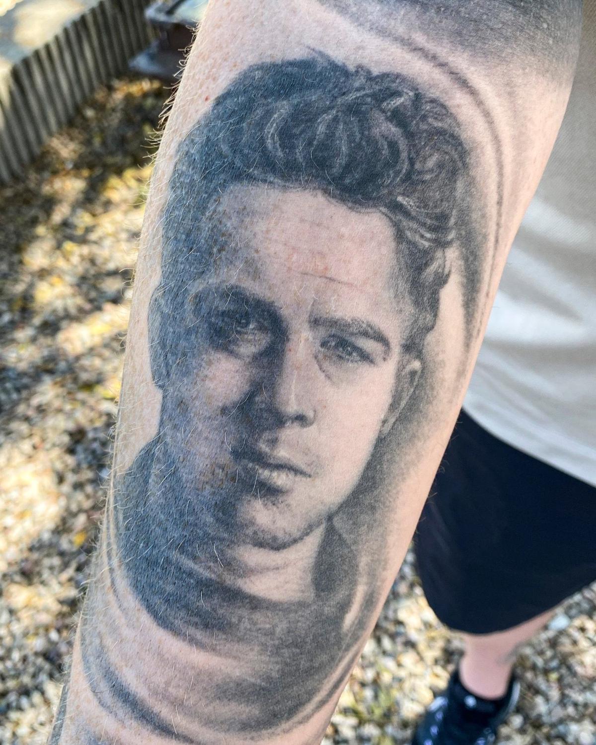James Dean memorabilia collector Neil Sheehan is organizing an effort to restore the 1977 memorial to the famed movie star who died east of Cholame in a 1955 car wreck. He has several tattoos of Dean like this one on his arm.