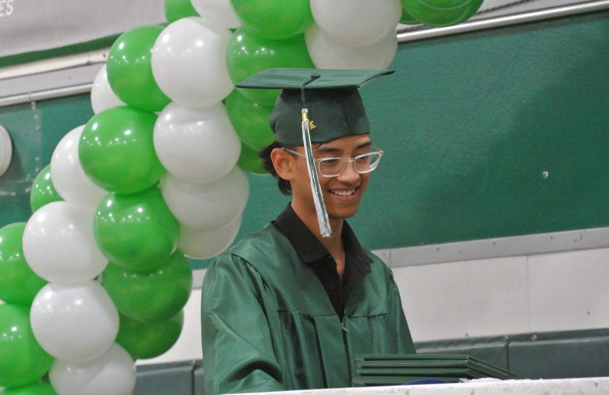 Eagle Canyon High School graduate Elijah Copen receives his diploma during a graduation ceremony at Templeton High School on June 3, 2025.