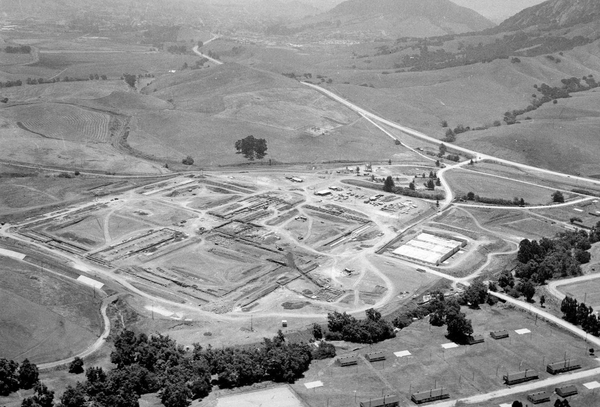 Aerial of the East facility, California Men’s Colony, CMC, under construction on July 1, 1959 San Luis Obispo in background.