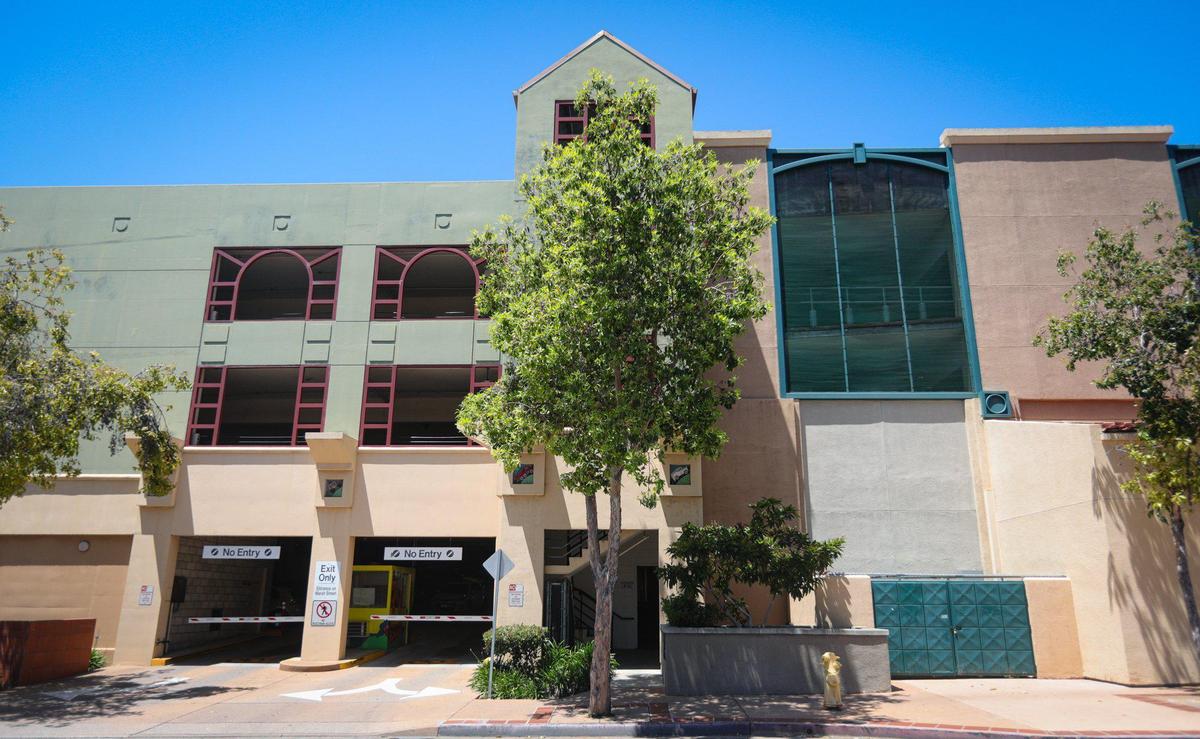 The older section of the Marsh Street parking garage has open windows, the newer annex on the right has many of the windows covered with screen. Mary Jane Jodry asks for safety improvements at city parking garages May 10, 2022; her son Thomas died in a fall from the Marsh Street structure.