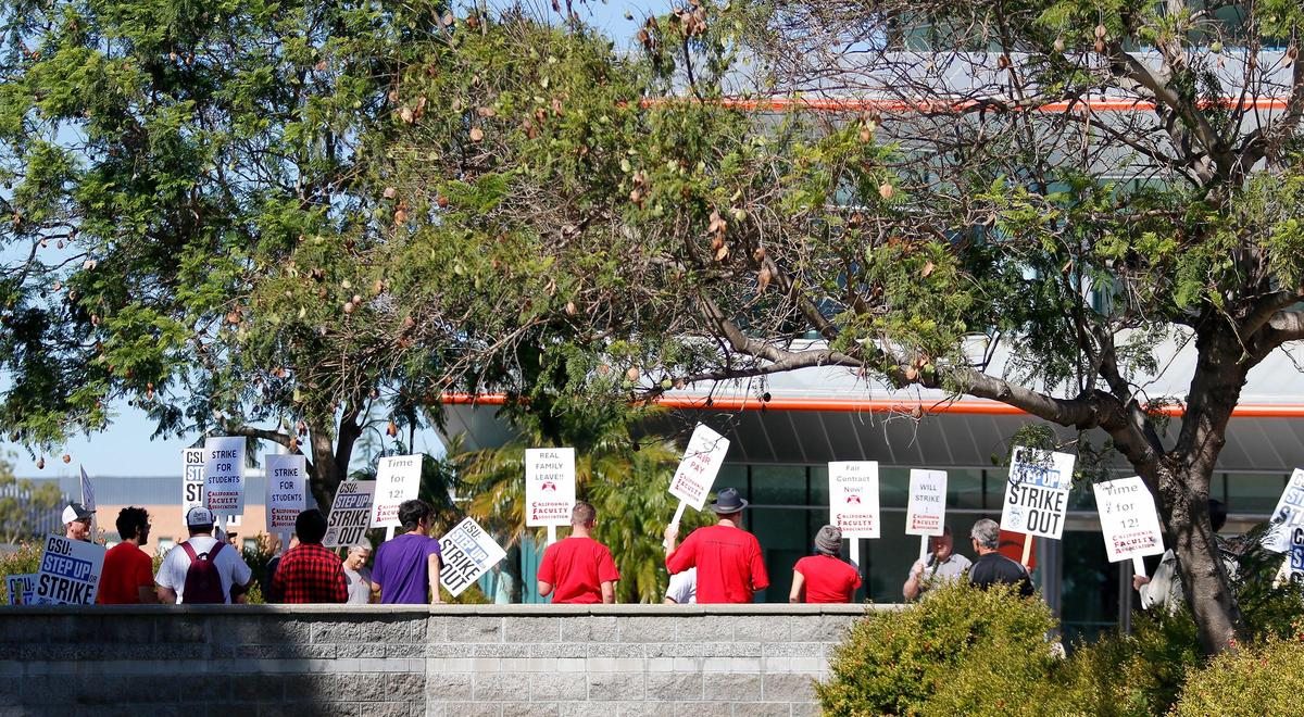 Members of the California Faculty Association picketed outside a Cal Poly alumni event at the Performing Arts Center on Friday, Oct. 27, 2023, in support of higher state university salaries.